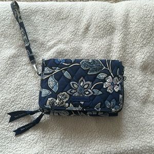 Vera Bradley wallet. Comes with 2 attachments (crossbody or wristlet).